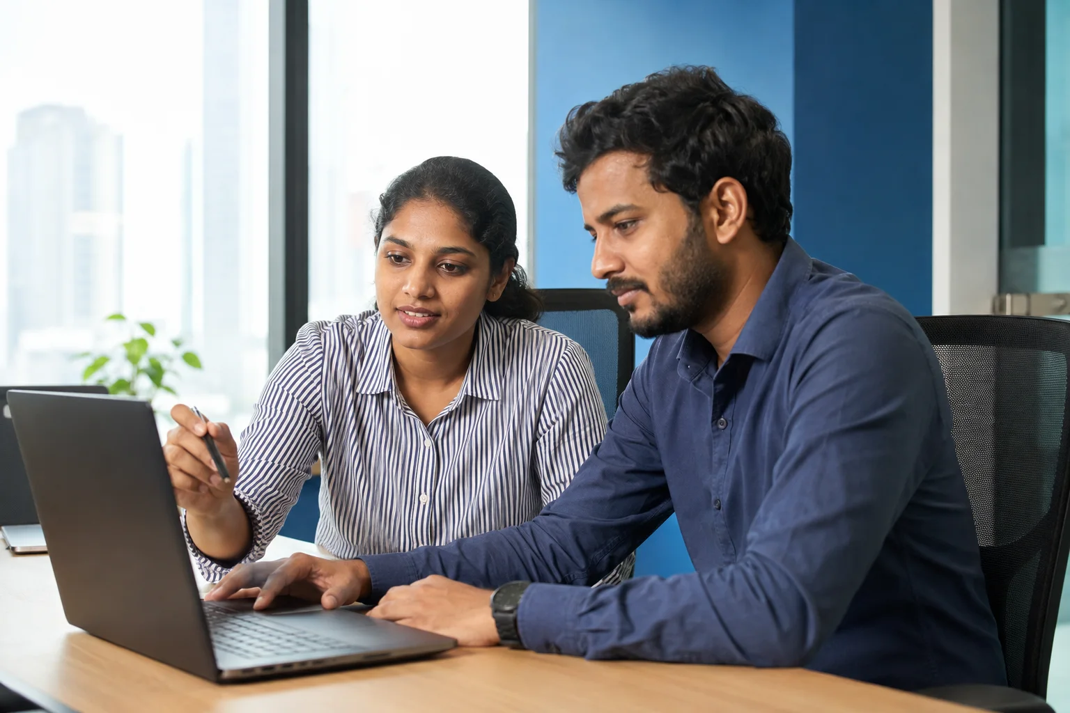 Sri Lankan developers working together on a laptop